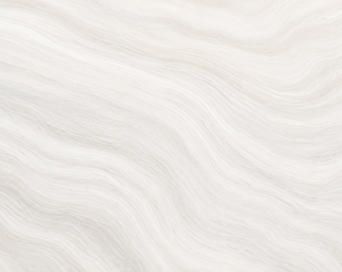 Soft white flowing fabric texture with gentle waves and folds creating an elegant minimalist background